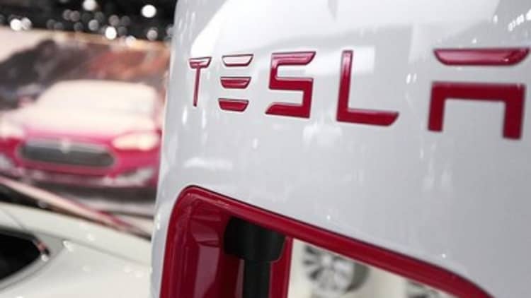 Tesla earnings stop short of estimates