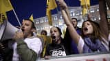 Protesters shout slogans during a rally in front of the Greek Parliament during a debate prior to a confidence vote in Athens in 2014.