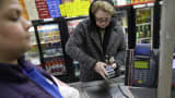 A woman pays for her groceries using a food stamp program at a supermarket in West New York, N.J., Monday, Jan. 12, 2015.