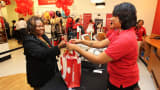 A customer shops at the opening of TJ Maxx's 1000th store in Washington, DC.