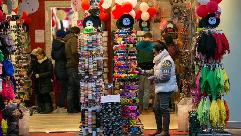 Shoppers browse items for sale inside a gift shop in Mannheim, Germany.