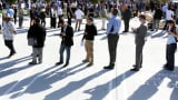 People line up for a job fair at a new Virgin Galactic and The Spaceship Company facility in Long Beach, California.
