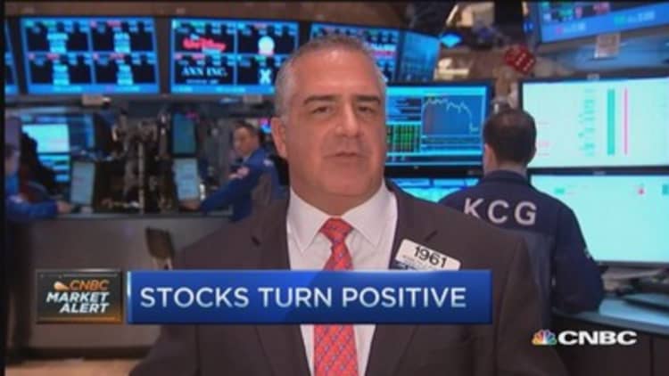 Stocks turn positive