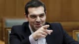 Greek Prime Minister Alexis Tsipras gestures during a cabinet meeting at the parliament building in Athens March 29, 2015.