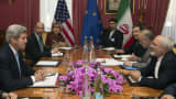 U.S. Secretary of State John Kerry (L) holds a negotiation meeting with Iran's Foreign Minister Mohammad Javad Zarif (R) over Iran's nuclear programme in Lausanne, Switzerland.