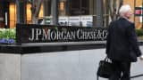 A pedestrian walks past the JPMorgan Chase headquarters building in New York.