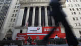 A woman walks past the New York Stock Exchange on May 6, 2010, the day of the "Flash Crash."