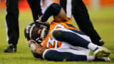 David Bruton of the Denver Broncos lies on the ground with a reported concussion, December 28, 2014.