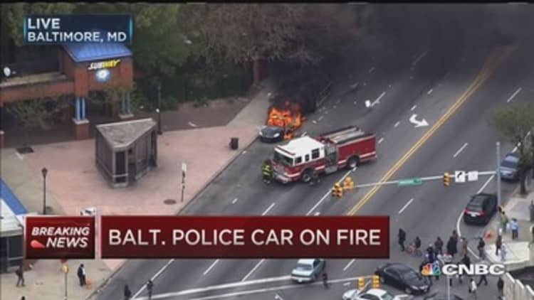 Baltimore police car set on fire