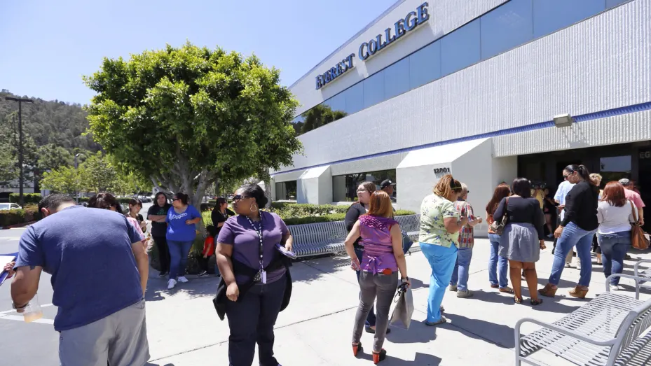 Teachers line up to enter Everest College, one of the Corinthian Colleges that closed, for a meeting and opportunity to collect their personal items, in City of Industry, Calif., April 27, 2015.