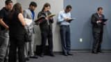 Job seekers wait in line to enter the Choice Career Fair in San Antonio, Texas.