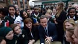 Prime Minister David Cameron and Education Secretary Nicky Morgan meet pupils during a visit to the Green School For Girls in London.