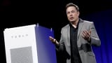 Tesla Motors CEO Elon Musk reveals a Tesla Energy battery for businesses and utility companies during an event in Hawthorne, Calif., April 30, 2015.