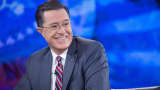 Stephen Colbert smiles while taping the "The Colbert Report" with President Barack Obama, not pictured, in Lisner Auditorium at George Washington University in Washington, Dec. 8, 2014.