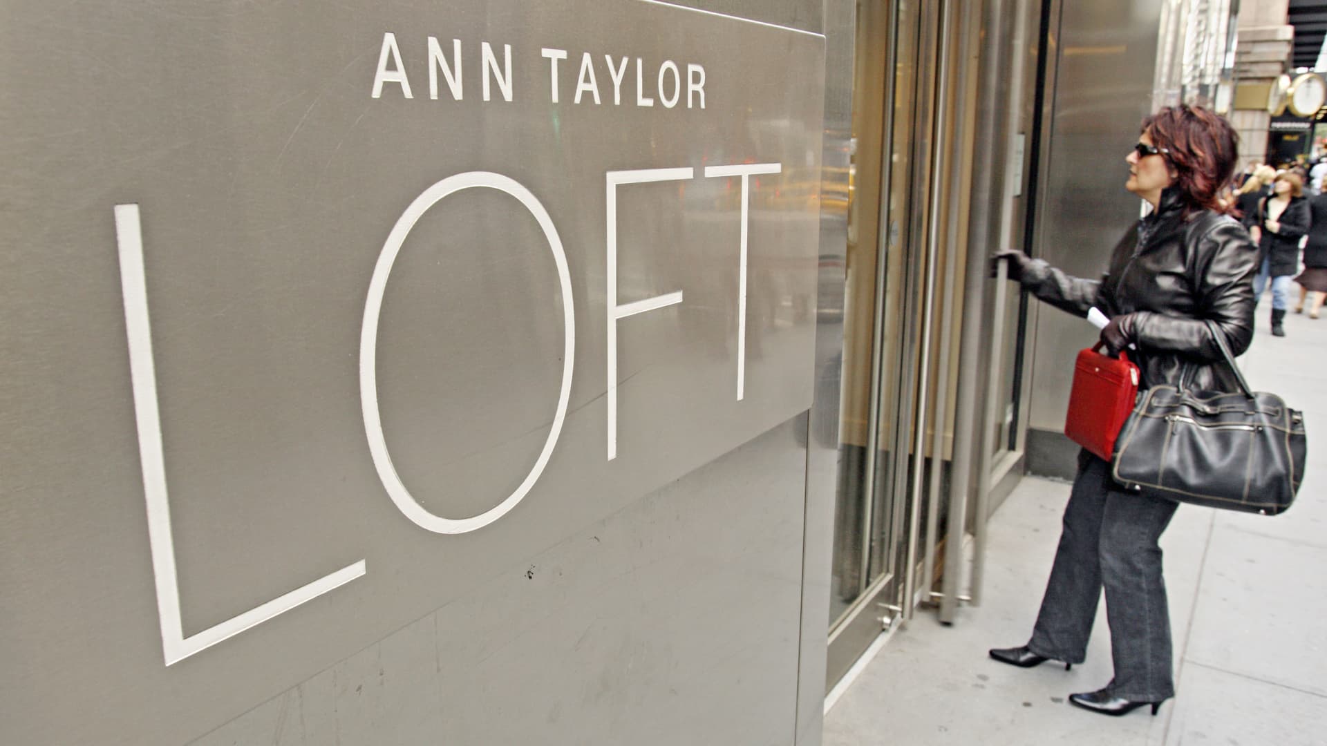 Shopper enters a Ann Taylor LOFT clothing store located on Madison Avenue in New York City.