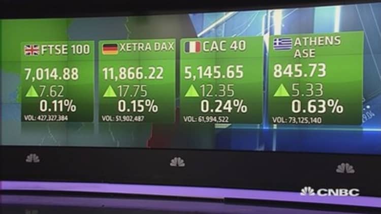 Europe ekes out gains to close higher after PMIs