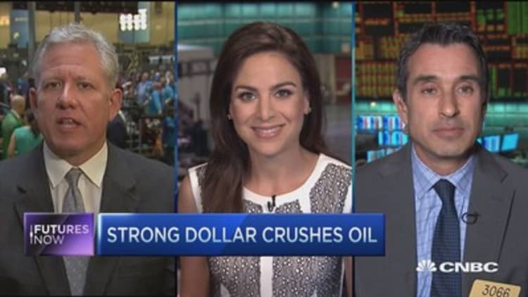 Futures Now: Strong dollar crushes oil