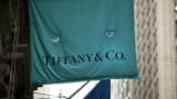 A flag for a Tiffany & Co. store hangs along Wall Street in Manhattan.