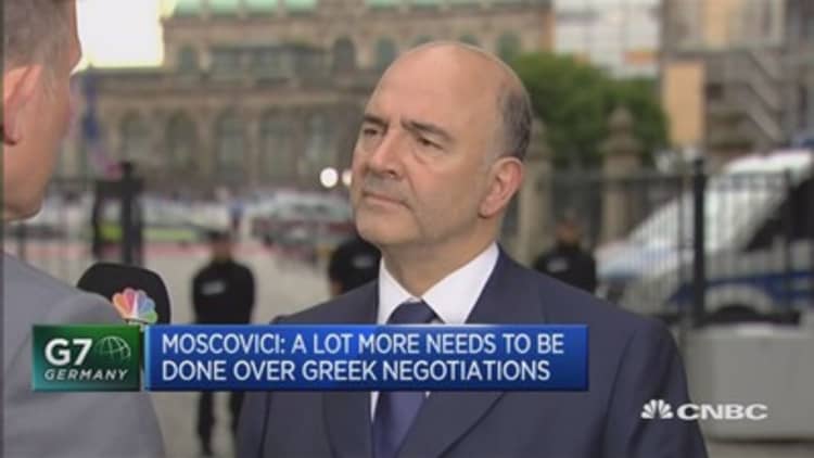 Dedicated to keeping Greece in EU: Moscovici