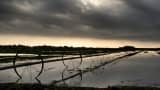 Farm irrigation equipment stands idle in the flooded fields after a storm dropped 2 inches of rain on Raymondville, Texas.