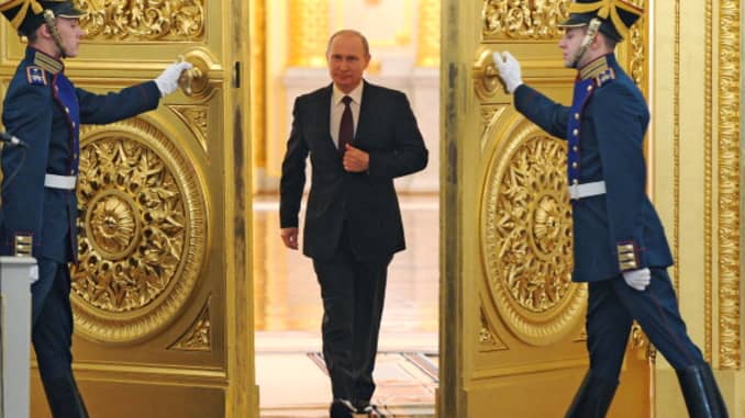 Russian President Vladimir Putin enters the St. George Hall at the Grand Kremlin Palace in Moscow.