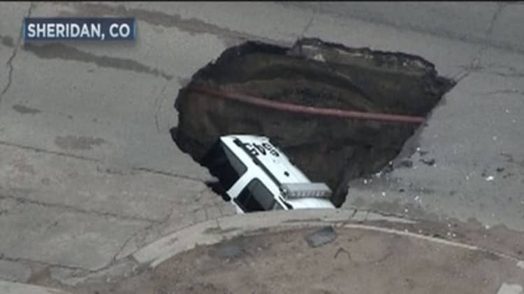 Sinkhole swallows police SUV 