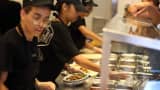 Chipotle restaurant workers fill orders for customers in Miami.