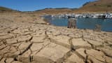 Dried mud and the remnants of a marina are seen at the New Melones Lake reservoir in California.