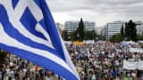 A Greek flag during a pro-government rally in front of the parliament building in Athens, Greece, June 21, 2015.