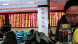 The words "[Playing the] stock market has its risks" are pasted on the walls of this stock exchange corporation in Nantong, Jiangsu province of China.