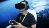 A man wears an Oculus VR headset as he plays a video game at the Electronic Entertainment Expo in Los Angeles, June 16, 2015.