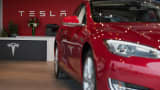 A Model S electric vehicle (EV) is displayed inside the show room at the Tesla Motors Inc. Gallery and Service Center in Paramus, New Jersey.