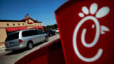 Drive-through customers wait in line at a Chick-fil-A restaurant in Fort Worth, Texas.