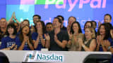 PayPal President and CEO Dan Schulman (center) joins employees, customers and Nasdaq employees while ringing the bell at Nasdaq this morning on July 20, 2015 in New York City.