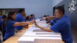 Apple Store employees fill orders of the new iPhone 6 in Palo Alto, California.