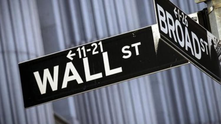 Wave of earnings flood Wall Street