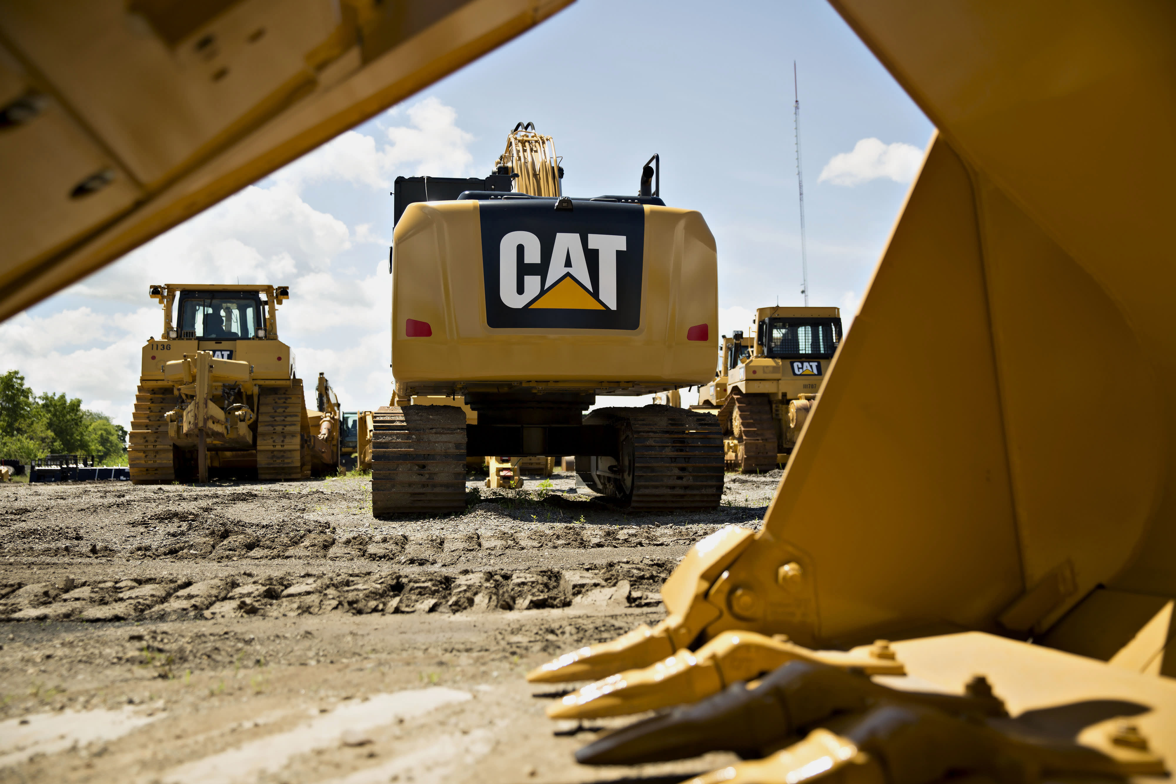 Stocks making the biggest moves premarket: Caterpillar, Chevron, Apple and others