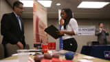 A job seeker meets with a recruiter during a HireLive career fair in San Francisco.