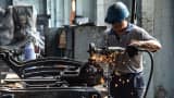 A worker repairs steam locomotive parts in Fuxin coal mine locomotive repair plant in Fuxin, China.