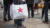 A shopper with a Macy's bag in New York.