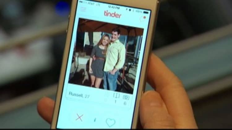 Tinder hooks up with new CEO