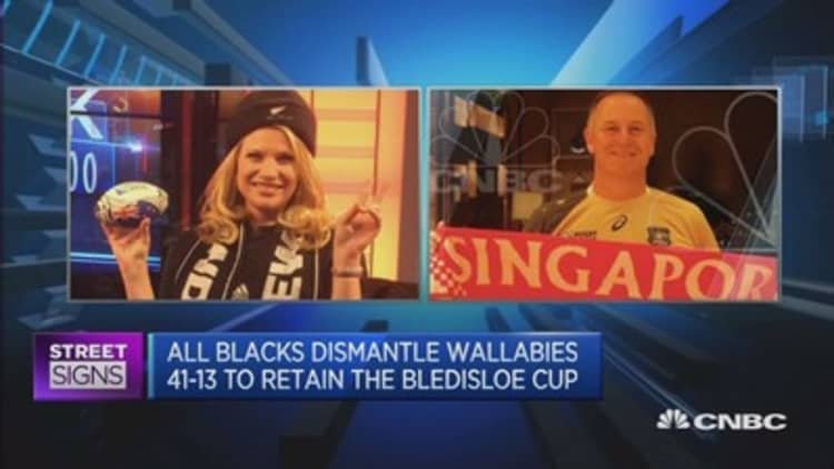 CNBC anchor loses bet, dons All Blacks scarf