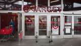 A customer pushes a shopping cart while exiting a Target Corp. store in Seattle, Washington.