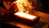 A melter casts an ingot of 92.96 percent pure gold at a procession plant of the Olimpiada gold operation, owned by Polyus Gold International company, in Krasnoyarsk region, Eastern Siberia, Russia.