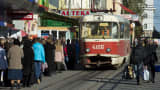 People queue up for a tram in a shopping area in Donetsk, Ukraine.