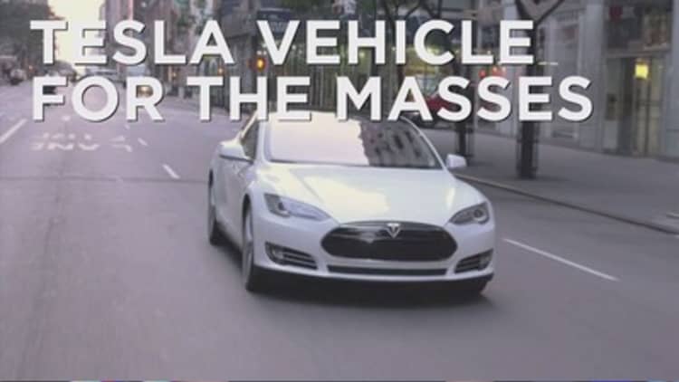 Tesla rolls out cars for the masses