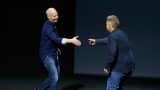 Kirk Koenigsbauer (left) is greeted by Apple's Phil Schiller as he takes the stage to discuss Microsoft Office for the iPad Pro during an Apple media event in San Francisco on Sept. 9, 2015.