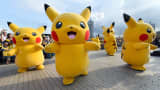 People dressed up as Pikachu, the famous character of Nintendo's videogame software Pokémon, dance in a Pikachu Outbreak event in Yokohama, Japan, in August.