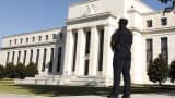 A Federal Reserve police officer keeps watch while posted outside the Federal Reserve headquarters in Washington.