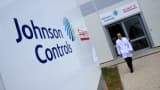 An employee walks through the Johnson Controls and Saft Groupe SA factory, a joint venture producing Lithium-ion batteries in Nersac, France.